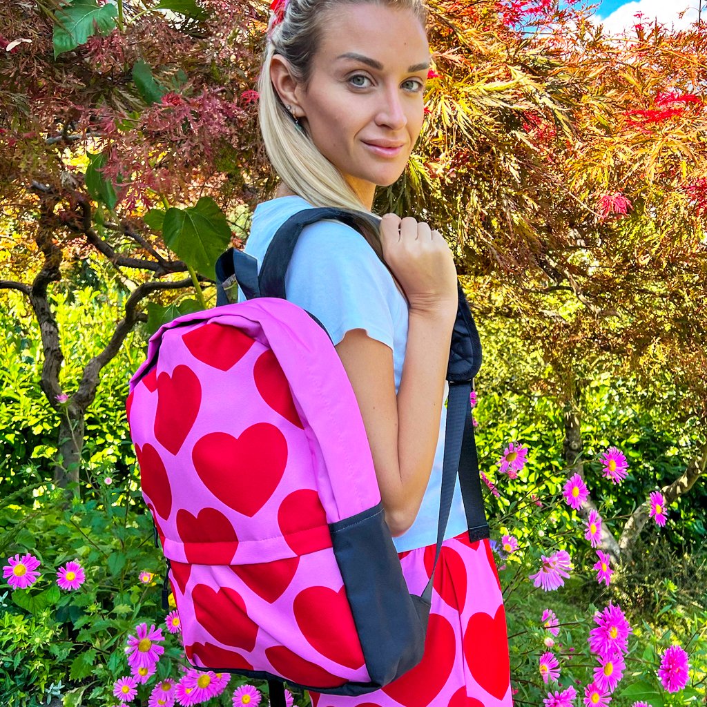 Lady in a colorful backpack by SHALMIAK. Design: ELLIE LOVE red.