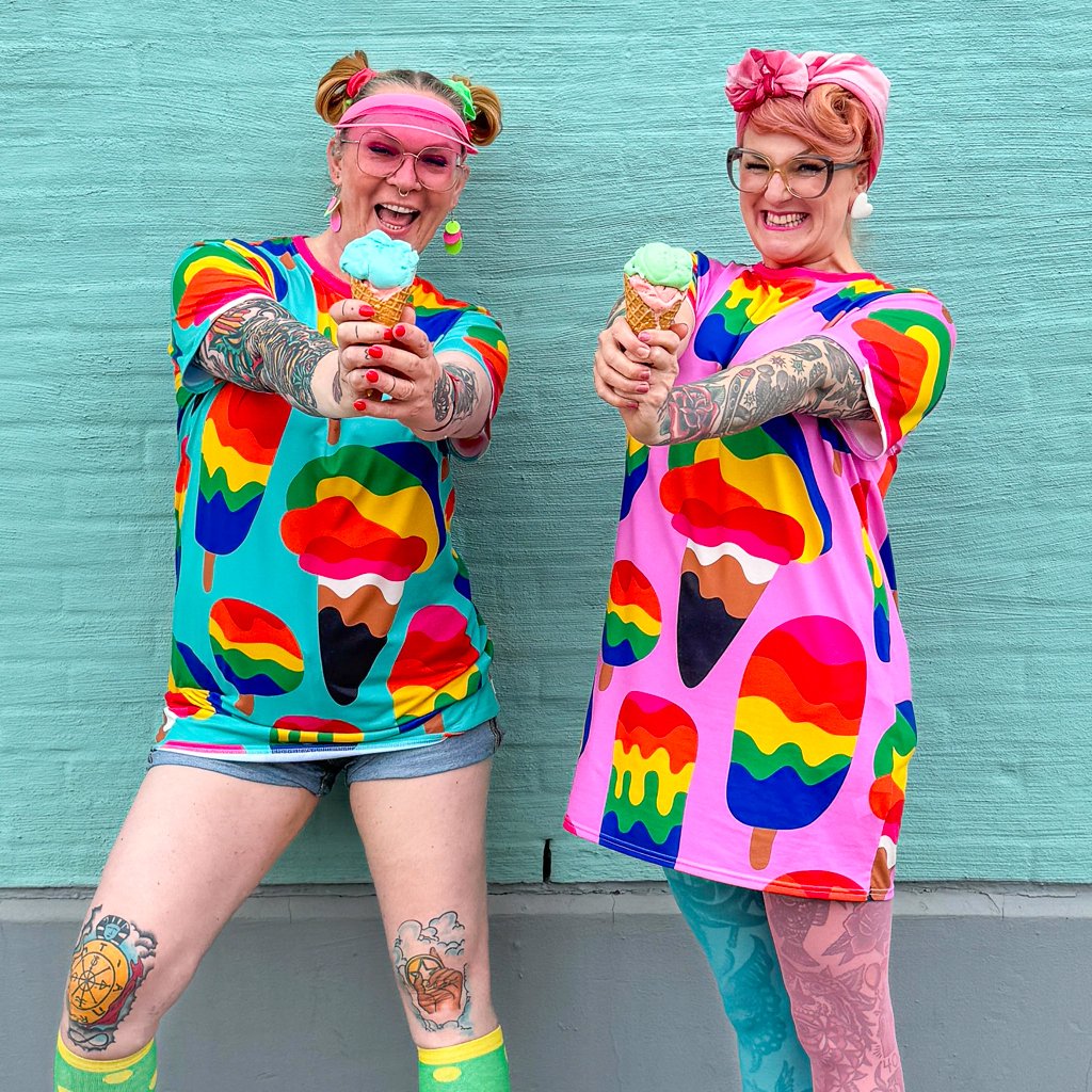 Two women wearing colorful t-shirt dresses by SHALMIAK. Design: MANIC ICE mint & MANIC ICE pink.